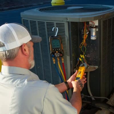 Technician Performing Ac Maintenance